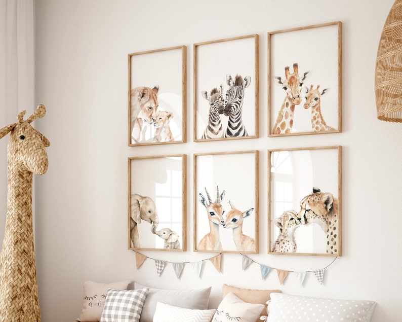 Neutral safari nursery decor with baby animal illustrations.