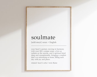 May include: A black and white printable art print with the definition of the word "soulmate" in English. The definition describes a soulmate as a partner who moves in harmony with your life, a love as radiant as the sunrise, and a spiritual bond that is deep and unexplainable. The print also includes the related terms "heart's echo" and "twin flame".