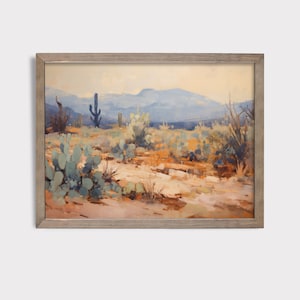 May include: A framed painting depicting a desert landscape with a blue sky, mountains in the distance, and various cacti and desert plants in the foreground.