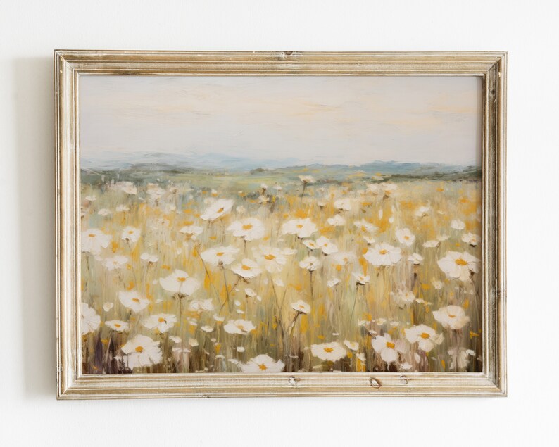 May include: A framed painting of a field of white wildflowers with a hazy background of hills in the distance.