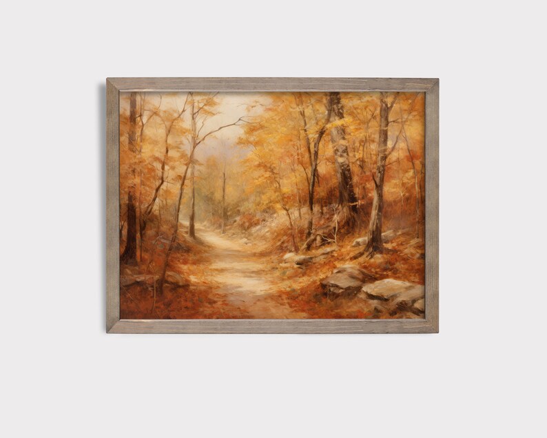 May include: A framed painting of a path through a forest in autumn. The trees are a mix of yellow, orange, and brown, and the path is lined with fallen leaves. The painting is in a rustic wooden frame.