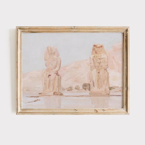 Puede incluir: Una pintura de dos grandes estatuas de piedra en un paisaje des&eacute;rtico. Las estatuas son de color marr&oacute;n claro y parecen ser de origen egipcio antiguo. El fondo es de un rosa y un azul suave y apagado.