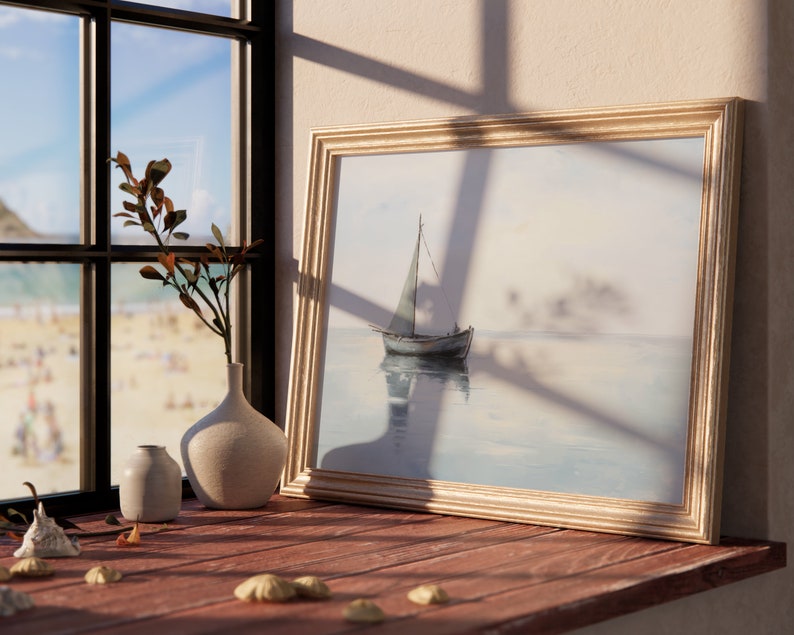 May include: A framed watercolour painting of a sailboat on a calm body of water. The painting is in a gold frame and is hanging on a wall. There are two white ceramic vases and a seashell on a wooden table in front of the painting.