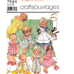 May include: Simplicity sewing pattern with illustrations of baby dolls in different outfits. The pattern shows dolls in a yellow onesie, a floral dress, a striped romper, and a red gingham romper. The pattern is labelled "crafts/ouvrages".