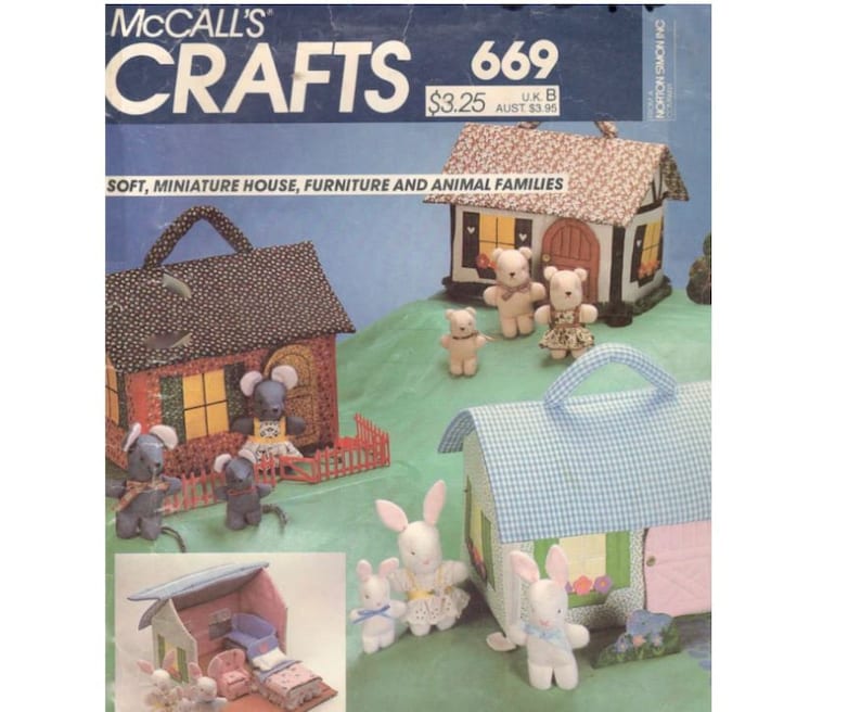 May include: A vintage McCall's Crafts sewing pattern, number 669, for making miniature houses, furniture, and animal families. The pattern cover features three houses made of fabric, each with a different animal family: mice, bears, and bunnies. The houses are decorated with gingham and floral patterns.