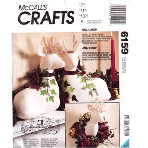 May include: A craft pattern for making two white reindeer decorations. The pattern is called "Holi-Deer" and "Joli Cerf". The reindeer are 14 inches (35 cm) and 18 inches (45 cm) tall.