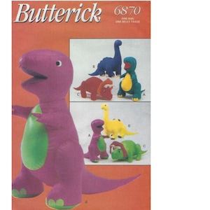 May include: A sewing pattern for dinosaur plush toys. The pattern features a large purple dinosaur with a green belly, and smaller versions in blue, red, green, and yellow. The pattern is labelled "Butterick 6870".
