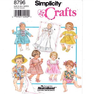 May include: A sewing pattern for making doll clothes. The pattern includes instructions for making a variety of outfits, including a blue dress, a yellow dress, a pink dress, a red and white striped dress, a floral swimsuit, and a plaid swimsuit. The pattern also includes instructions for making a bonnet, a hat, and a blanket.