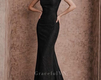 May include: A floor-length black gown with a fitted bodice and a flared skirt. The dress features short sleeves and a high neckline. The fabric has a subtle textured pattern. The text "Graceful VN" is visible at the bottom of the image.