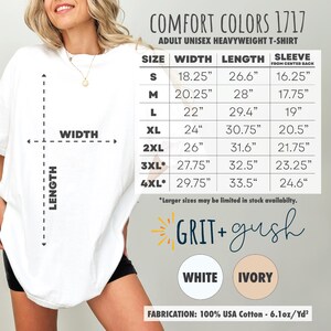 May include: A size chart for a unisex heavyweight t-shirt. The chart shows the width, length, and sleeve length in inches for sizes S through 4XL. The text "GRIT + gush" is printed in a yellow sunburst design. The colors white and ivory are shown in circles below the text. The text "FABRICATION: 100% USA Cotton - 6.1oz/Yd2" is printed at the bottom.