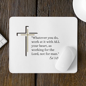 May include: White mousepad with a printed cross design and the text "Whatever you do, work at it with ALL your heart, as working for the Lord, not for man." Col 3:23. A white computer mouse rests on the pad.