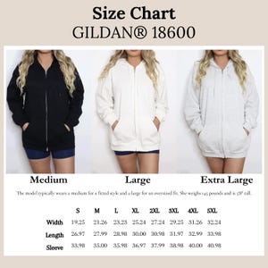 May include: Size chart for Gildan 18600 zip-up hoodies. The image shows three hoodies in black, white, and gray. The chart includes measurements for width, length, and sleeve length in inches, ranging from size S to 5XL. The model is 5'8" and weighs 145 pounds.