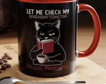 Funny Cat drinking Coffee mug stating “Let me check my Give-o-shit meter; Nope, nothing”