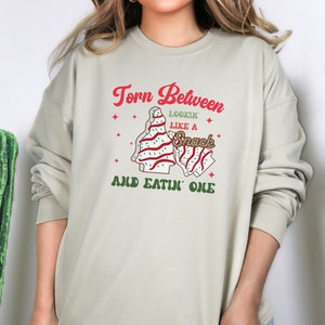 Torn Between Lookin Like A Snack, Christmas Tree Cake Sweatshirt, Christmas Crewneck, Holiday Sweatshirt, Funny Christmas Gift Sweatshirt