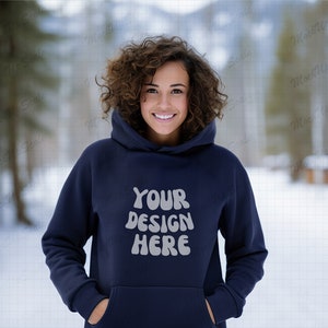 May include: A navy blue hoodie with a white graphic that says "YOUR DESIGN HERE". The hoodie has a drawstring hood and a kangaroo pocket.