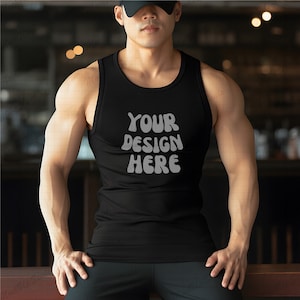 Muscular Asian Male Model Black Tank top Mockup | Black Gildan GD12 tank top mock up with black hat | indoor setting | man with muscle model