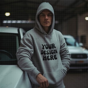 Male Gray Hoodie Mockup | Gildan 18500 sport grey Mockups | g185 sport gray Hoodie Mock | garage setting | mock up with car | leaning to car