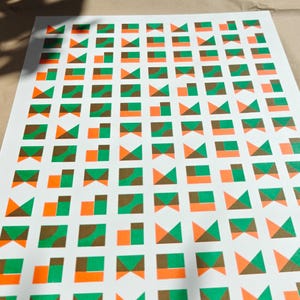 Limited edition geometric riso print on quality paper — small squares with triangles and curves in green, orange and brown