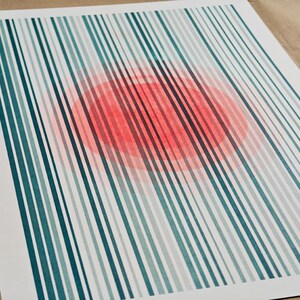 The full A3 riso print flat on kraft paper — vertical teal stripes with a soft fluorescent orange-red circle glowing through the centre