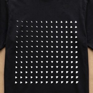 Collage: man wearing the black triangle grid t-shirt, black flat lay with 2XS–5XL size label, and man in dark grey t-shirt with the rotating triangle pattern