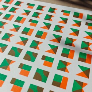 Eco-friendly A3 risograph print with an abstract grid of geometric tiles in green and orange, limited edition gallery art