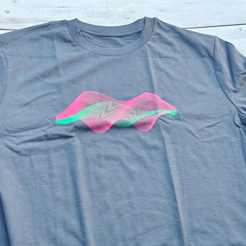 Heather grey t-shirt flat lay with the pink and green generative wave surface print