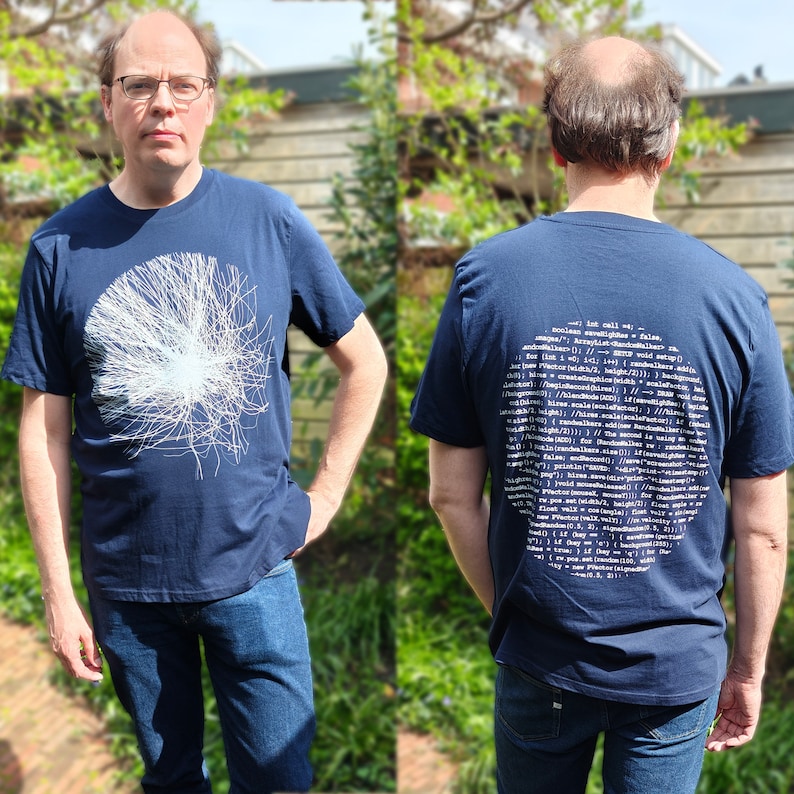Front and back of the navy 2-sided t-shirt worn outdoors — particle burst on the front, handwritten source code on the back