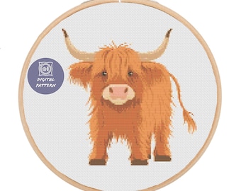 May include: A digital cross stitch pattern featuring a cute, brown Highland cow with long, fluffy hair. The pattern is framed in a wooden embroidery hoop.