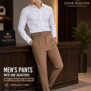 May include: A white long-sleeved button-down shirt paired with tan high-waisted trousers featuring a wide waistband, side adjusters, and front pleats. The trousers have a tailored fit and are worn with dark brown leather dress shoes.