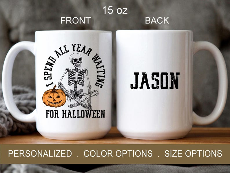 May include: White ceramic mug with a black and white illustration of a skeleton holding a pumpkin. The text on the mug reads "I spend all year waiting for Halloween". The back of the mug has the name "JASON" in black text.