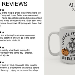 May include: White ceramic coffee mug with a black and white illustration of a skeleton holding a pumpkin. The text on the mug reads "I spend all year waiting for Halloween".