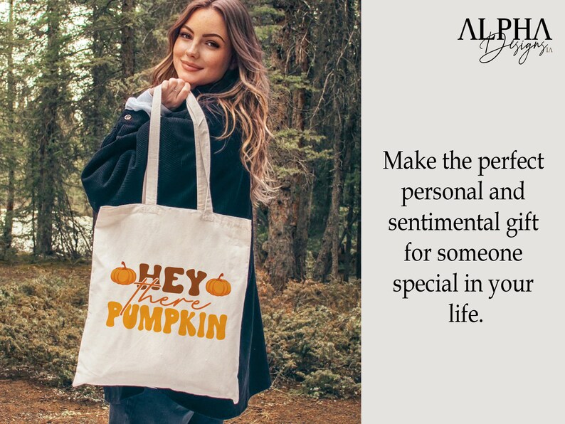 May include: A white tote bag with the text "HEY there PUMPKIN" in orange and brown lettering. The bag is decorated with two orange pumpkins.