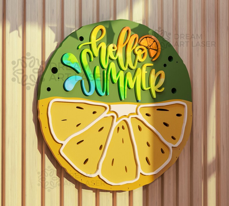 May include: A round wooden sign with a green background and a yellow lemon slice. The sign says "hello summer" in rainbow lettering.