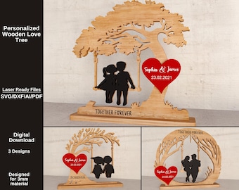 May include: A personalized wooden love tree with a laser-cut design. The tree features a heart with names and a date, and a silhouette of a couple on a swing. The base reads "TOGETHER FOREVER". The design is for 3mm material.
