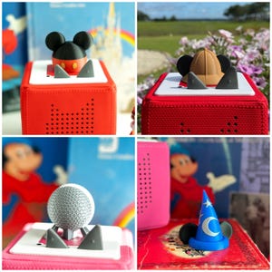 May include: A collage of four images featuring red and pink audio players with various Mickey Mouse-themed accessories. The accessories include a Mickey Mouse head, a detective hat, a silver sphere, and a blue wizard hat with a crescent moon.