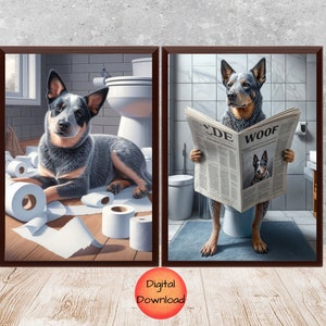 May include: Two framed illustrations of blue heeler dogs in a bathroom setting. The first image shows a dog sitting on a toilet with a newspaper titled "CDE WOOF" in its paws. The second image shows a dog surrounded by toilet paper rolls.