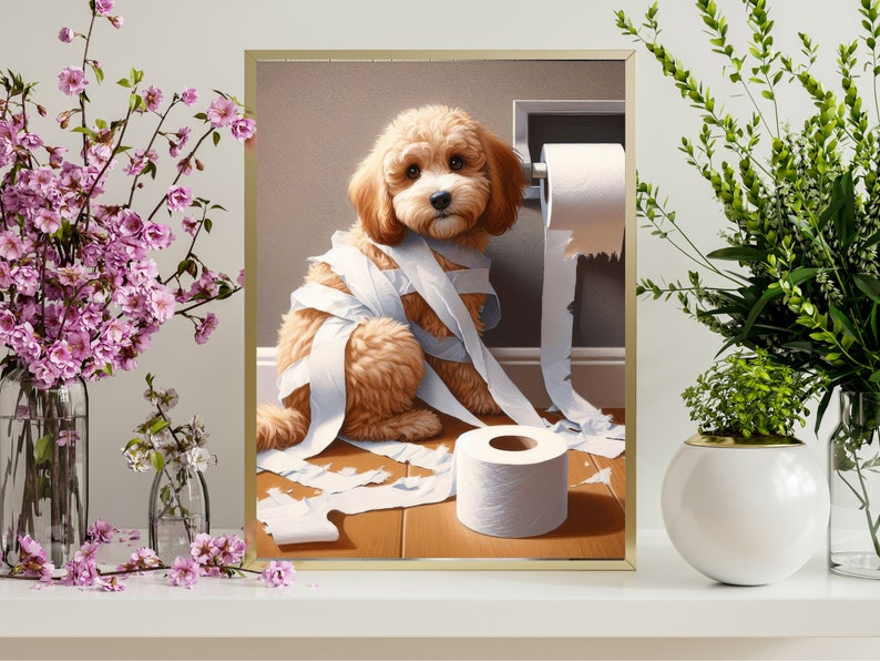 May include: A light brown dog with a white roll of toilet paper wrapped around its body. The dog is sitting on a wooden floor with a roll of toilet paper on the floor next to it.