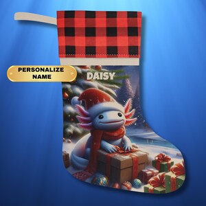 May include: A red and black buffalo plaid Christmas stocking with a personalized name "Daisy" and a cartoon axolotl wearing a Santa hat and holding a gift box.