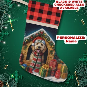 May include: Personalized Christmas stocking featuring a dog in a doghouse with presents and the name "BOBO" on the dog's collar.  Black and white checkered stocking also available.