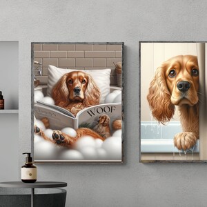 May include: Two framed illustrations of a brown and white cocker spaniel dog. The first image shows the dog relaxing in a bathtub with bubbles and reading a magazine titled "Woof". The second image shows the dog peeking out from behind a shower curtain.