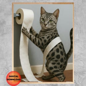 May include: A framed digital download featuring a Bengal cat playing with a roll of toilet paper. The cat has a spotted coat and is wrapped in the paper. The image has a light wood frame and a red circle with the words "DIGITAL DOWNLOAD".