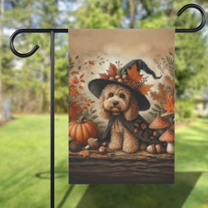 May include: A brown and white dog wearing a witch's hat with autumn leaves and acorns. The dog is sitting on a log with a pumpkin, acorns, and mushrooms.