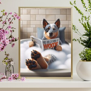 May include: A blue and white Australian Shepherd dog relaxes in a white bathtub filled with bubbles. The dog is wearing a blue collar and is holding a magazine that says "The OJ of Woode".