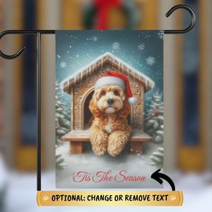 May include: A Christmas-themed garden flag featuring a brown dog wearing a Santa hat, sitting in a wooden doghouse with a snowy background. The text "'Tis The Season" is printed at the bottom of the flag.