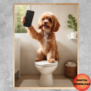 May include: A brown and white dog is sitting on a white toilet seat in a bathroom. The dog is holding a black smartphone in its paws and looking at the camera. The bathroom has white tile walls and a green plant in a white pot.