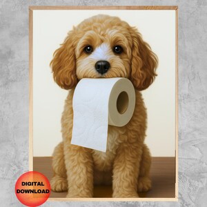 May include: A digital download print of a cute, fluffy, golden-brown dog holding a roll of white toilet paper in its mouth. The dog is sitting on a wooden surface, with a light background. The print is framed in a wooden frame.