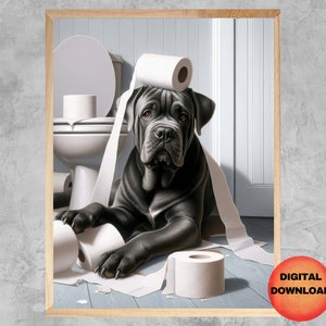 May include: A black dog with a roll of toilet paper on its head sits in a bathroom with a toilet and more toilet paper. The dog is looking at the camera.