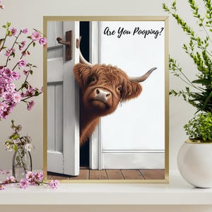 May include: A brown and white Highland cow peeks through a white door with the text "Are You Pooing?" printed above the cow.