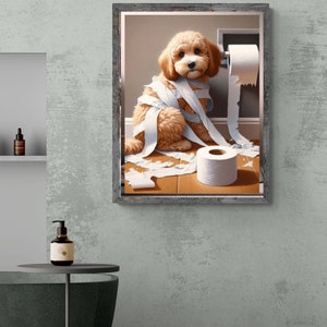 May include: A framed painting of a light brown dog with white fur, sitting on a wooden floor. The dog is tangled in toilet paper, and there is a roll of toilet paper on the wall behind it.