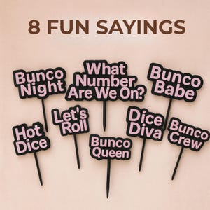 May include: A collection of eight black and pink Bunco game-themed signs. Each sign features a different phrase, including "Bunco Night," "What Number Are We On?," and "Bunco Babe." The words are in pink with a black border.